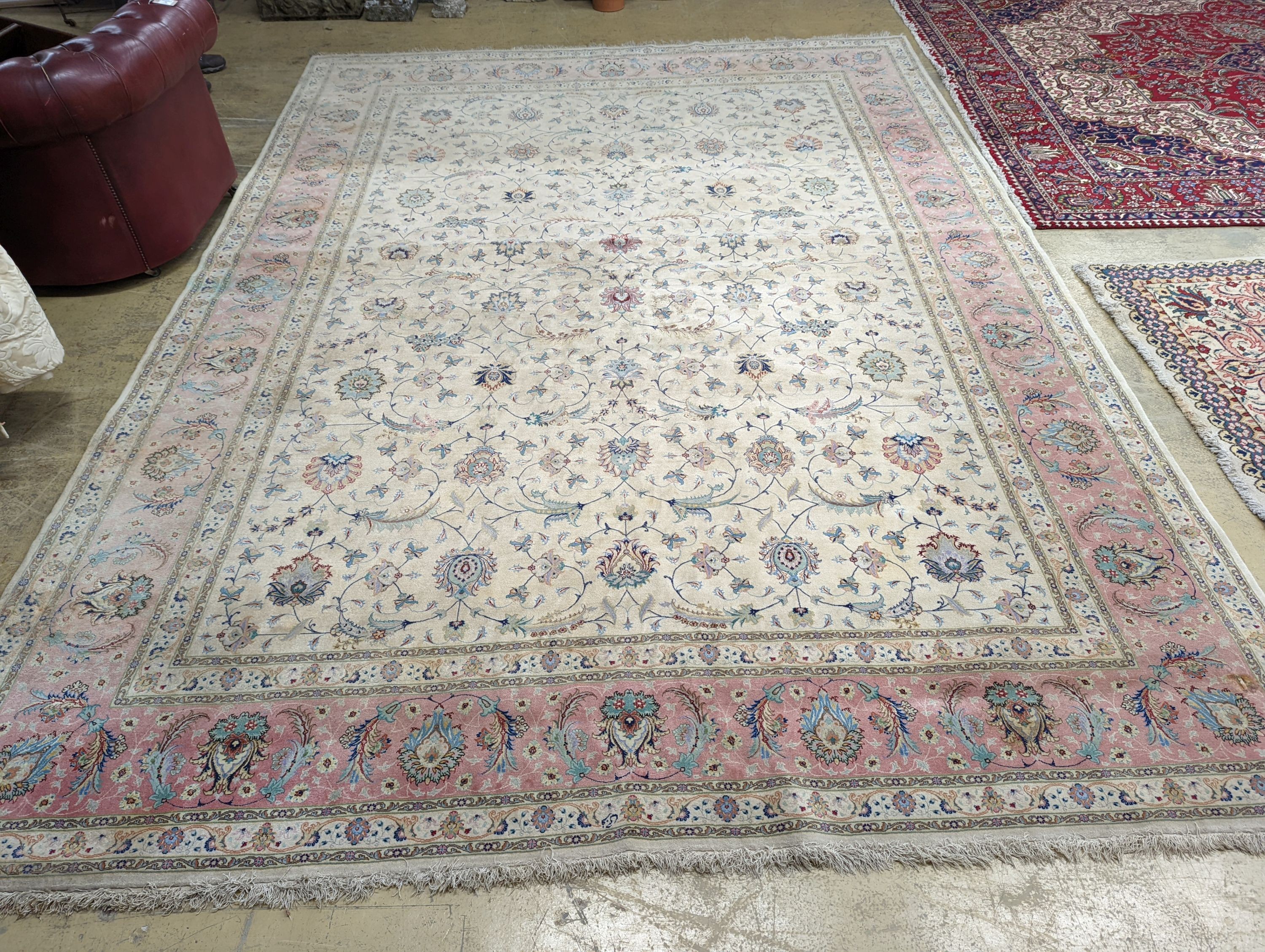 A Persian Tabriz ivory ground carpet, 410 x 300